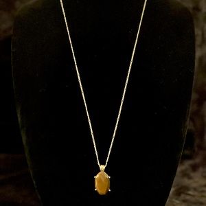 Silver tone necklace with Tiger Eye Pendant